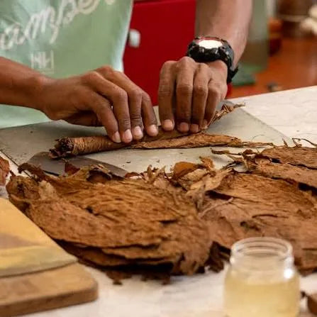 Hands finishing rolling work